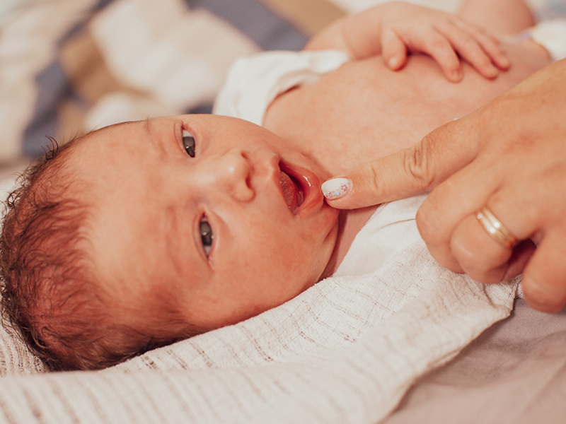 Baby laying in a crib