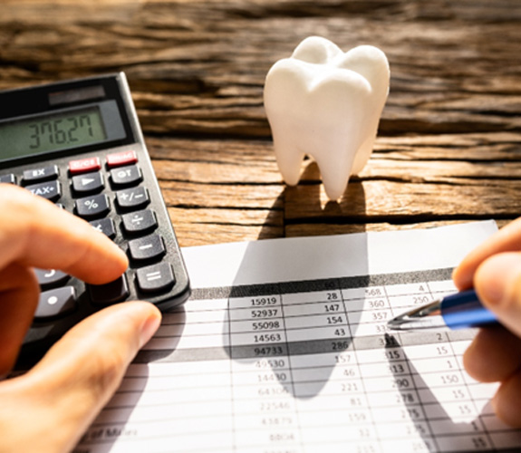 A patient calculating the cost of their clear aligners