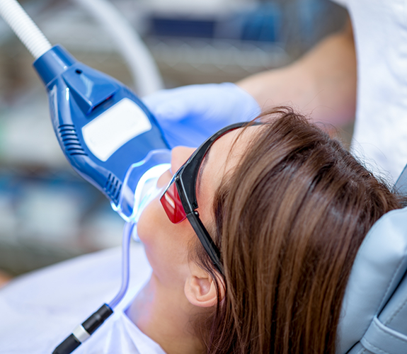 Dental patient getting her teeth professionally whitened