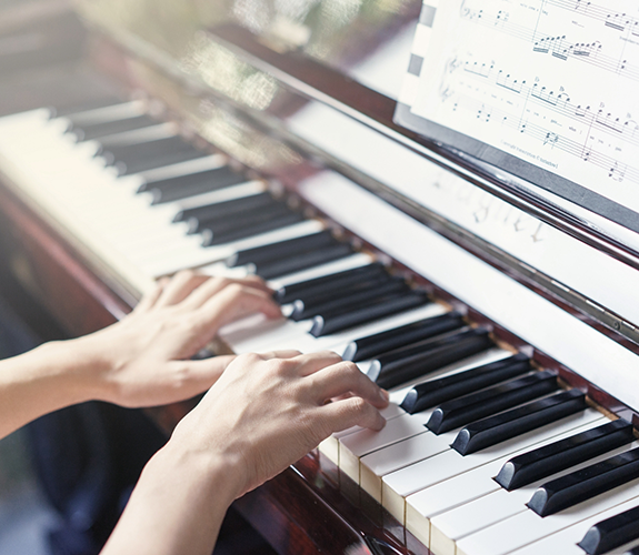 Person playing a piano