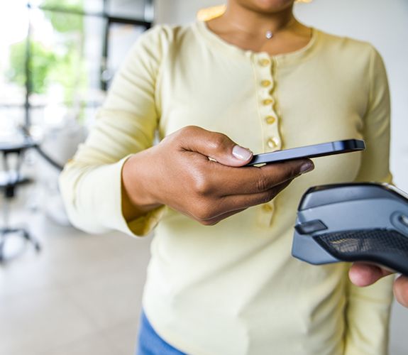 Woman scanning her phone to pay