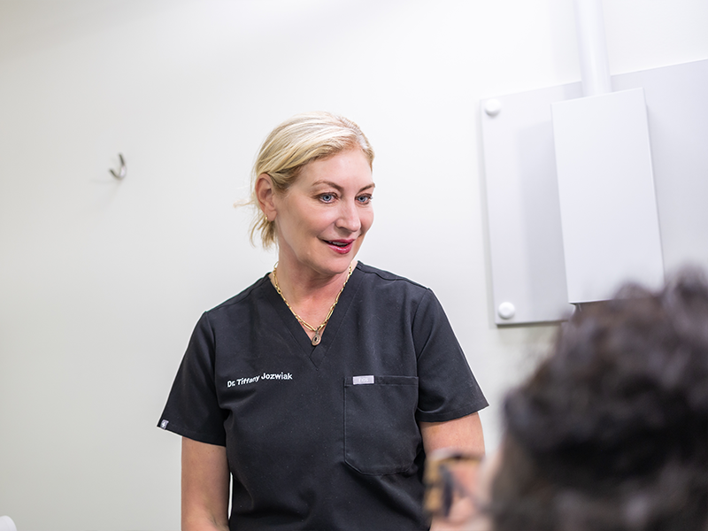 Dentist talking with a patient